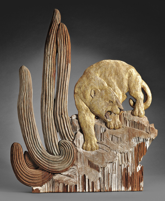 Mary Ogden Abbott (American/Concord, Mass., 1894-1981) wall sculpture, relief-carved, stained and burnished giltwood panel depicting a stalking mountain lion amidst rockery and cactus. Estimate $5,000-$10,000. Image courtesy Skinner Inc.